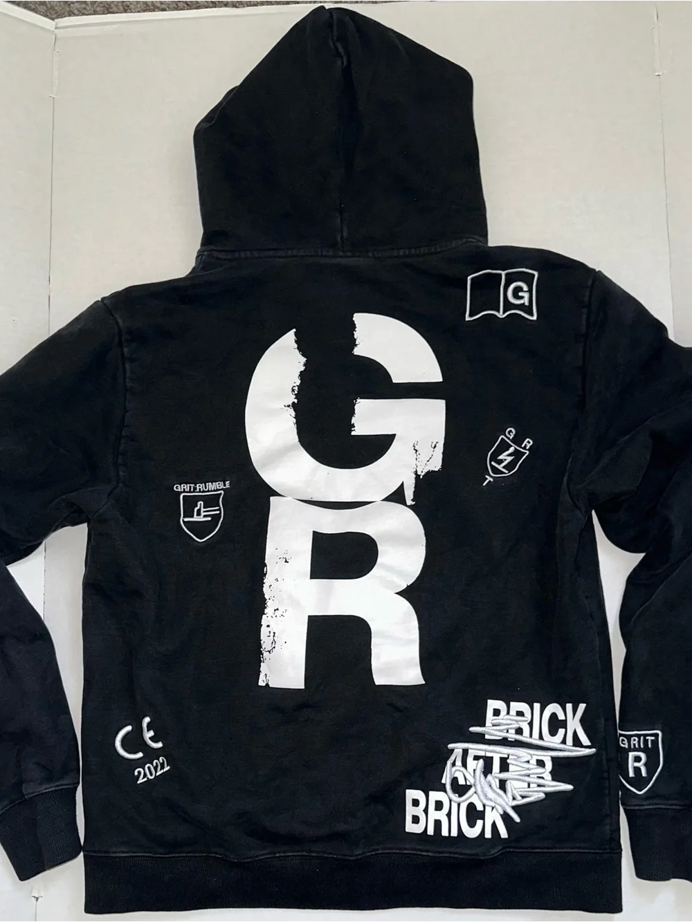 True Grit Black Pullover Hoodie with White Graphics